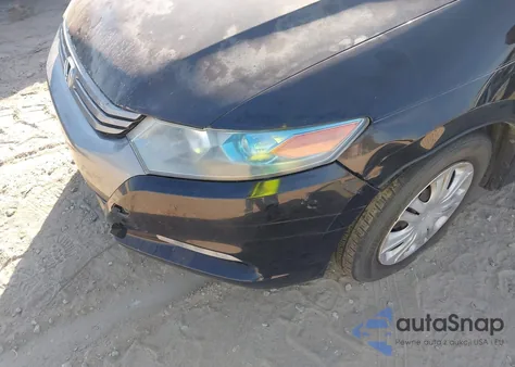 2011 Honda Insight from USA, damaged, VIN JHMZE2H36BS006488